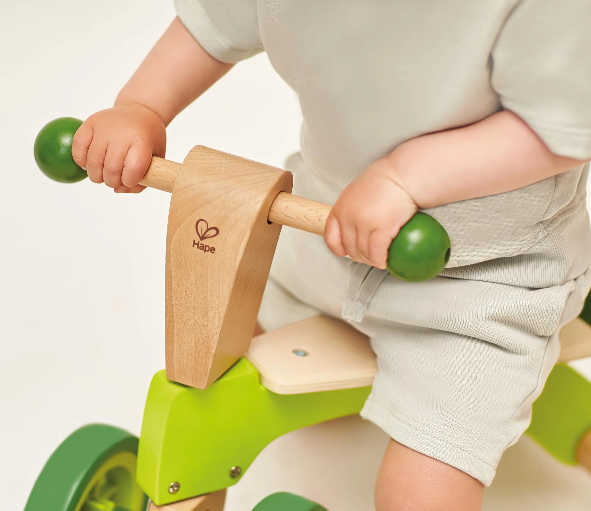 Hape Scoot-Around Balance Bike 4-Wheeled Sustainable Wood Rubber Tyres Bright Green