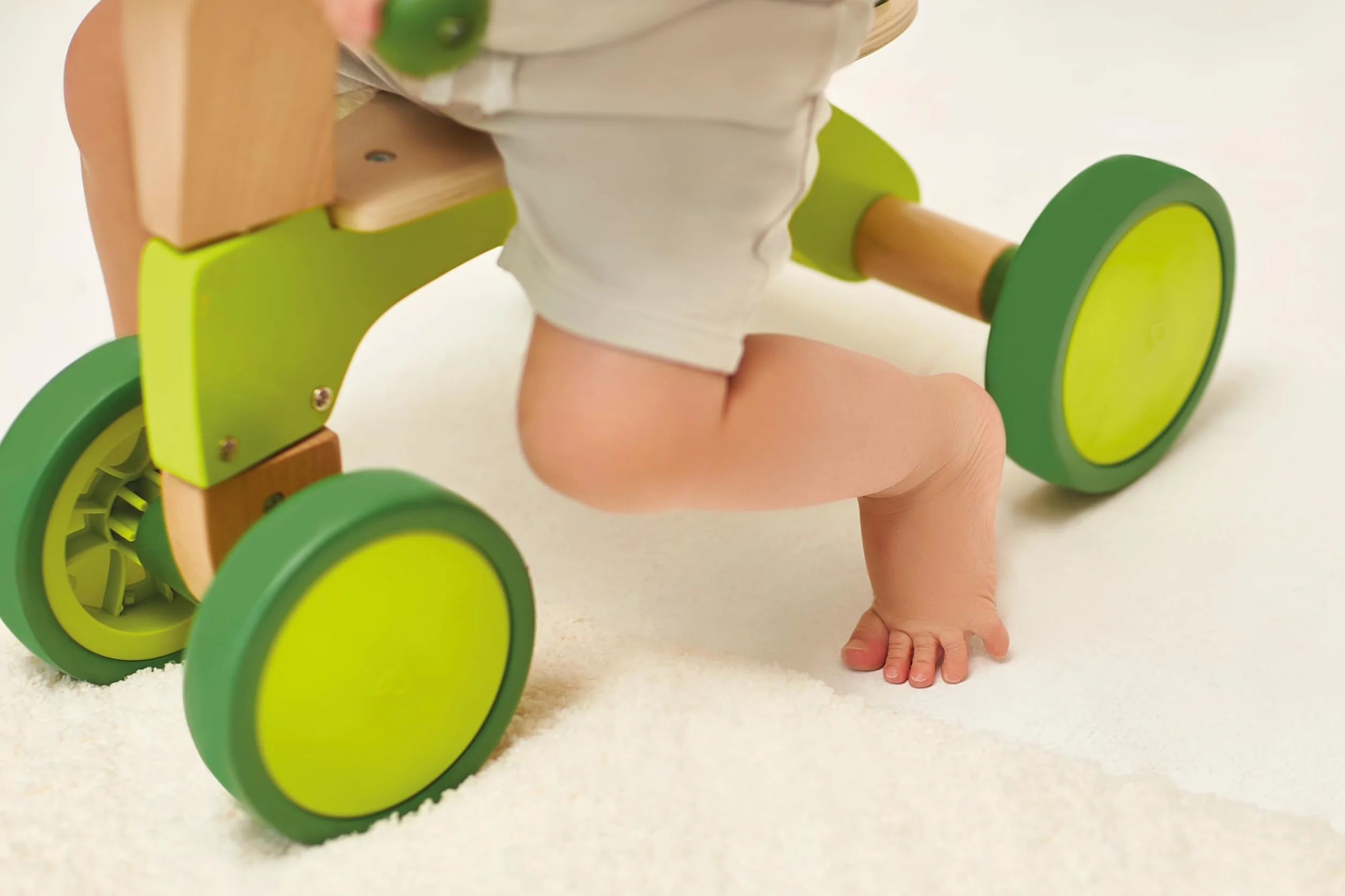 Hape Scoot-Around Balance Bike 4-Wheeled Sustainable Wood Rubber Tyres Bright Green