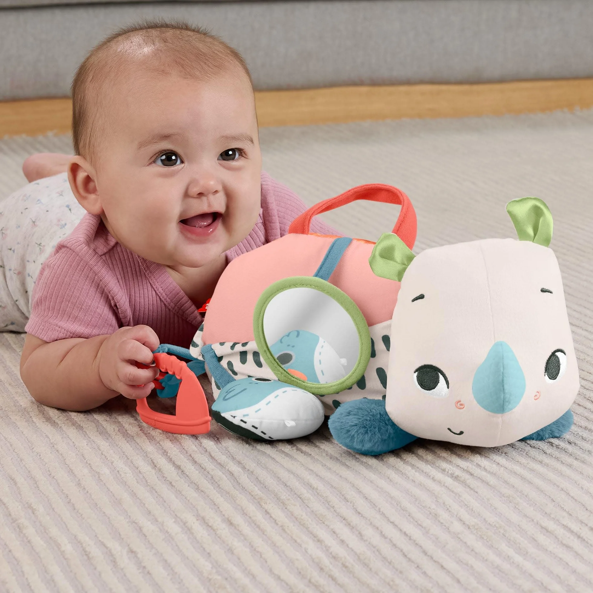 Fisher-Price Planet Friends Nosorożec aktywizujący Miękka zabawka sensoryczna do zabawy na brzuszku, HYR55