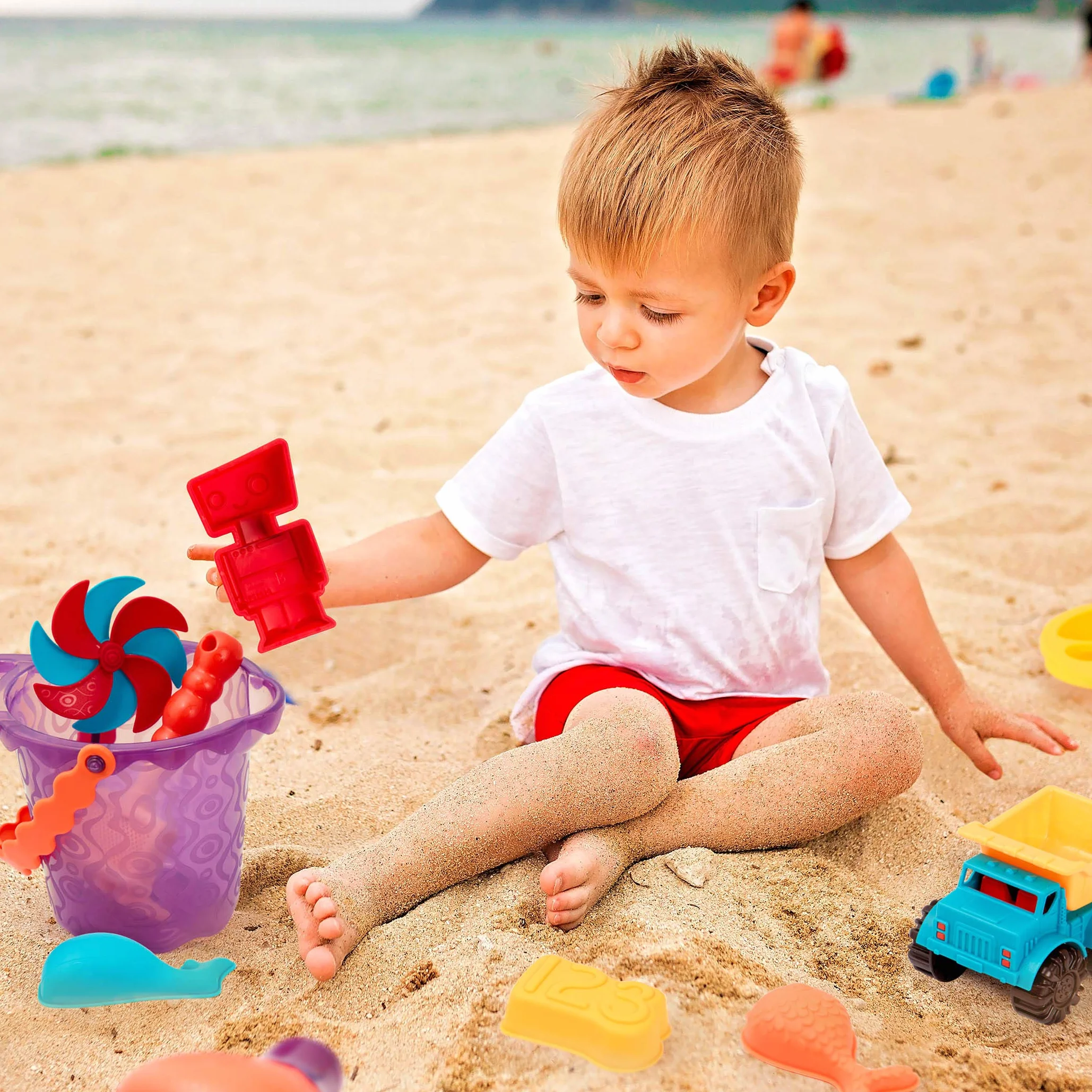 B. Zabawki – Gotowa torba plażowa – zabawa w wodzie – torba z paneliem siatkowym i 11 zabawkowymi zabawkami z piasku – 18 m+, fioletowe wiadro