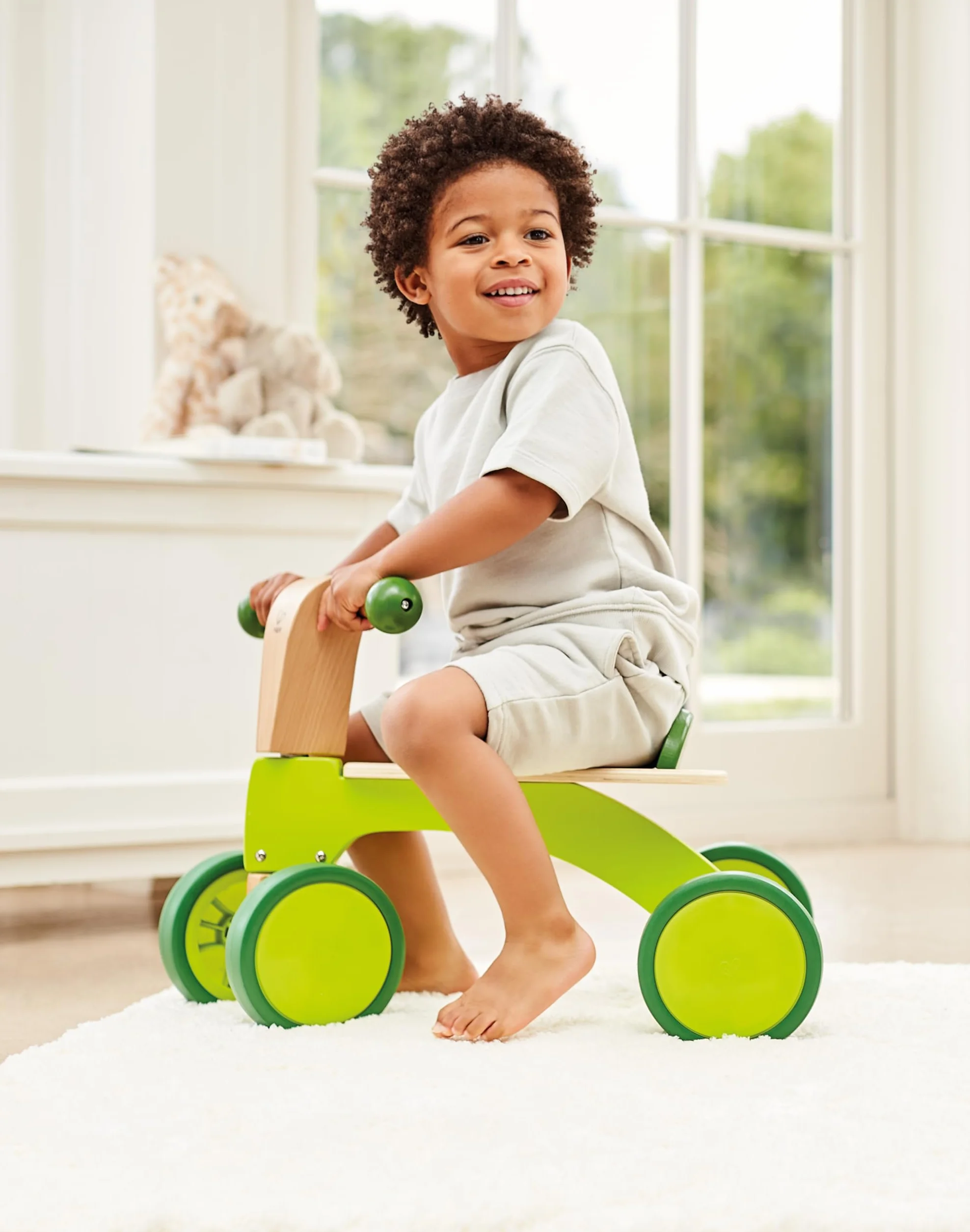 Hape Scoot-Around Balance Bike 4-Wheeled Sustainable Wood Rubber Tyres Bright Green
