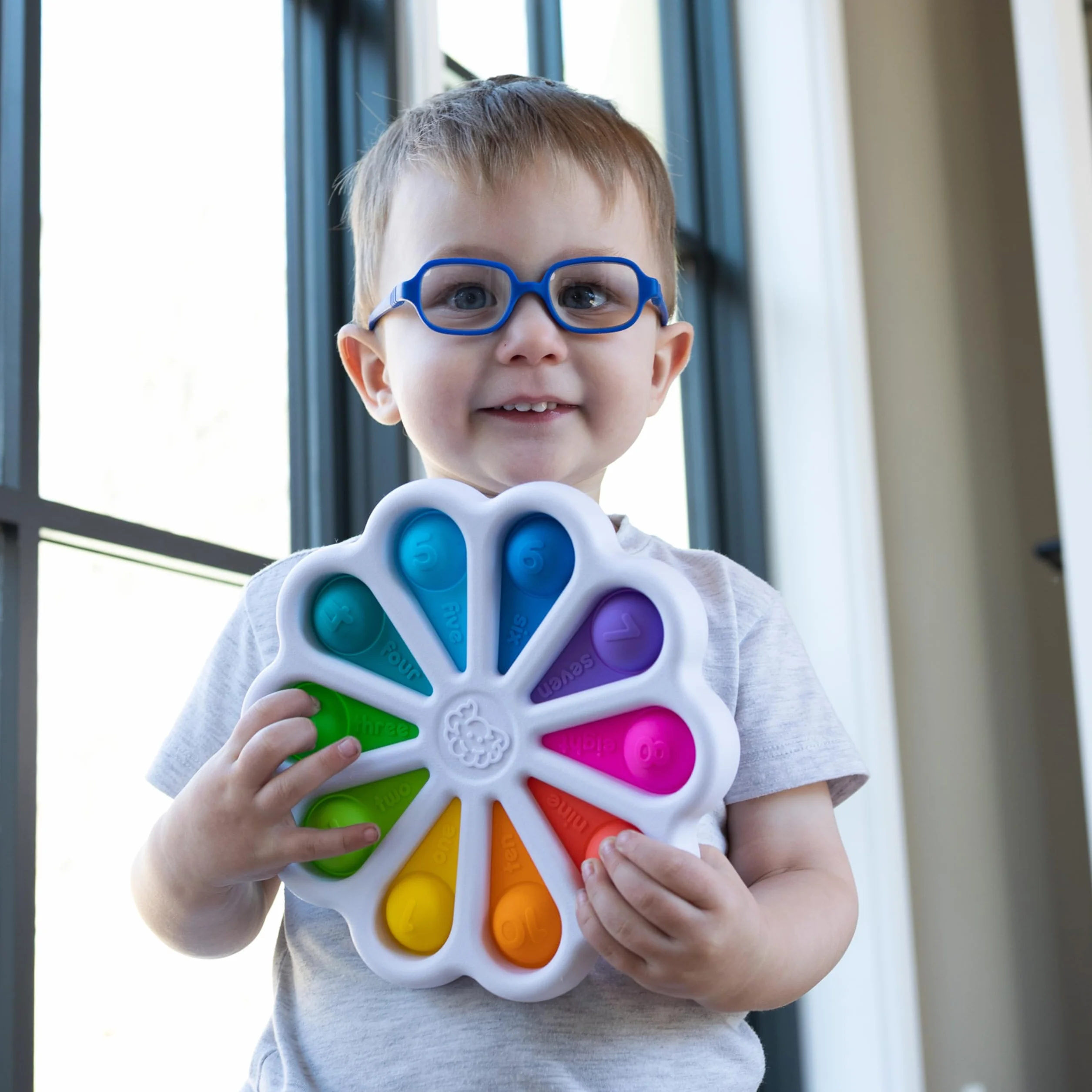 Fat Brain Toys Cyfry Dimpl zabawka edukacyjna sensoryczna dla niemowląt od 2 lat wielokolorowa